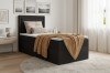 Schwarzes Boxspringbett mit Stauraum, weißem Topper und gelber Decke auf hellem Holzboden.