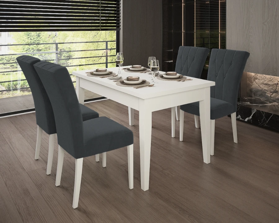 Eetgroep met witte eettafel en vier donkergrijze gestoffeerde stoelen in modern interieur.