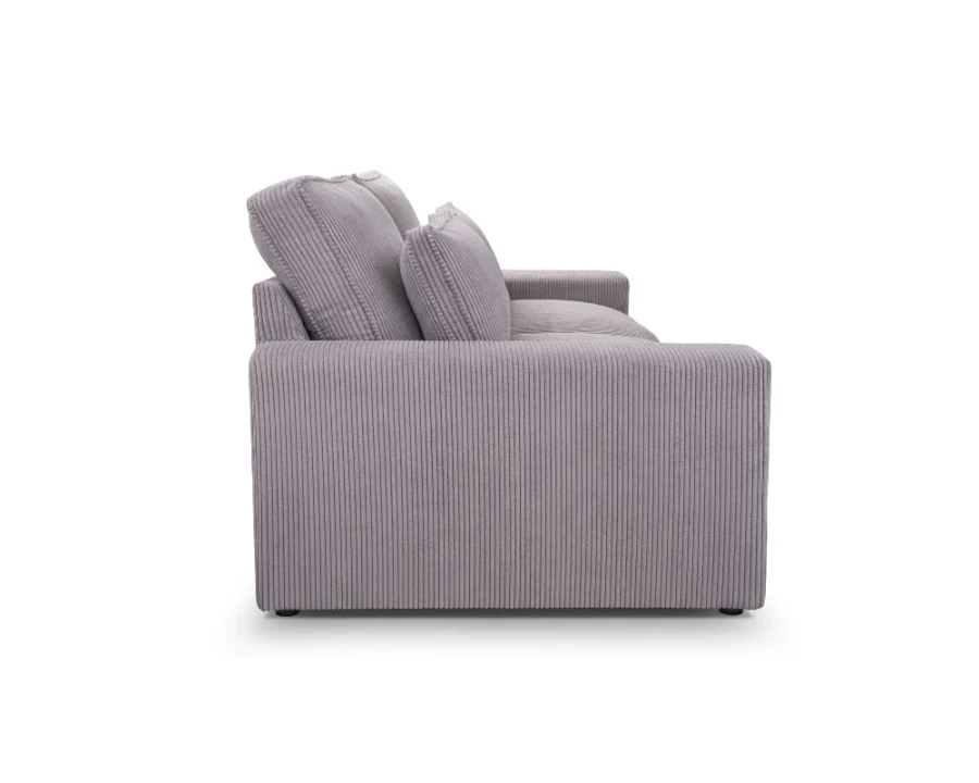 Seitliches Profil eines modernen grauen Cord-Sofas mit breiter Armlehne.