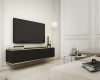 Schwarzes schwebendes TV-Lowboard mit Golddetails in stilvollem, hellem Wohnzimmer.
