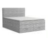 Hellgraues Boxspringbett mit Cord-Struktur und zwei geräumigen Schubladen am Fußende.