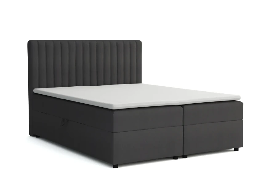 Dunkelgraues Boxspring-Doppelbett mit vertikal gestepptem Kopfteil.