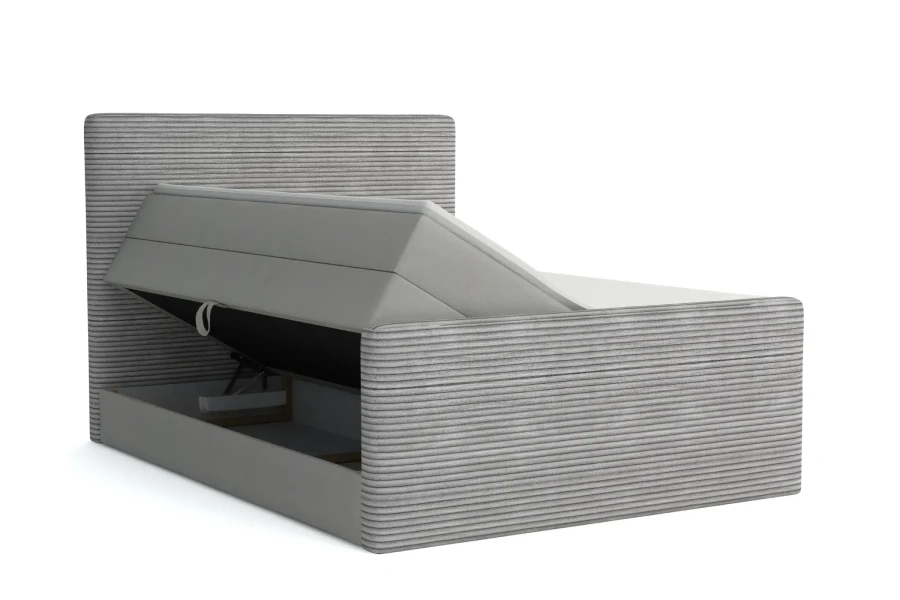 Hellgraues Boxspringbett in Cord-Optik mit offenem Bettkasten für zusätzlichen Stauraum.