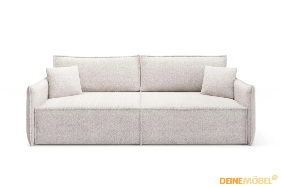 Frontansicht des beigen Designersofas LILA mit passenden Zierkissen.