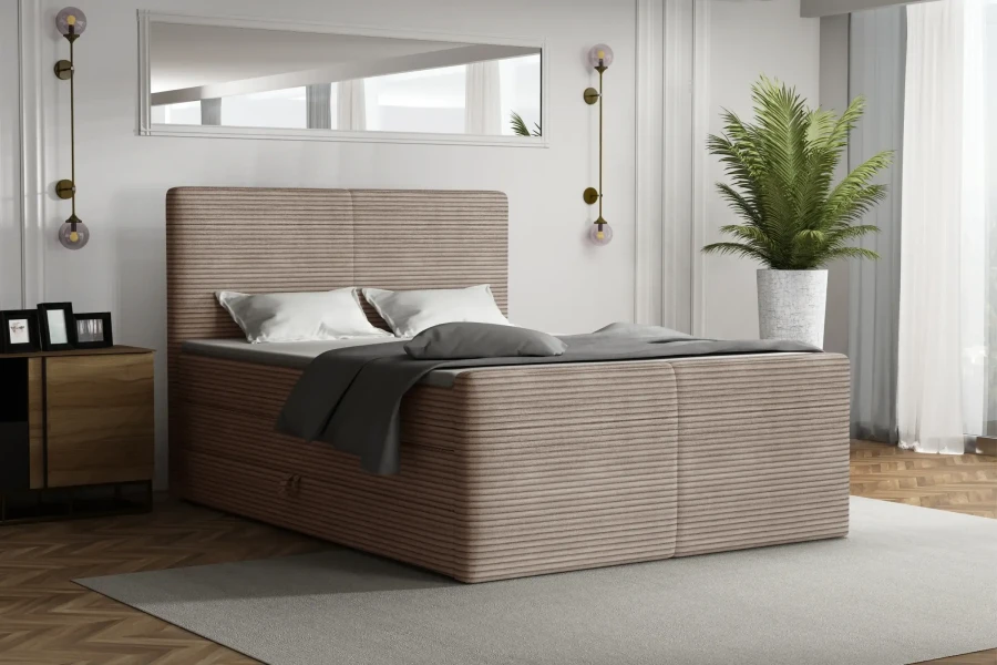 Modernes Boxspringbett Rocky in einem stilvoll eingerichteten Schlafzimmer.