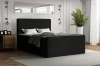 Schwarzes Boxspringbett Rocky im elegant eingerichteten Schlafzimmer mit Dekoration.