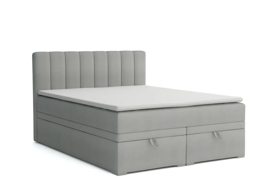 Modernes Boxspringbett in Hellgrau mit weichem Kopfteil und Stauraum.