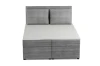 Frontalansicht eines gemütlichen Boxspringbetts in Grau mit dekorativem Breitcord-Muster.