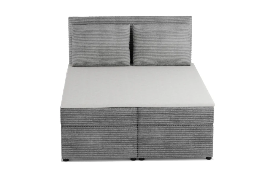 Frontalansicht eines gemütlichen Boxspringbetts in Grau mit dekorativem Breitcord-Muster.