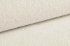 Nahaufnahme von weißem Bouclé-Stoff mit weicher Textur