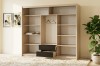 Beiger Kleiderschrank mit schwarzen Schubladen und Kleiderstange in einem hellen Zimmer.