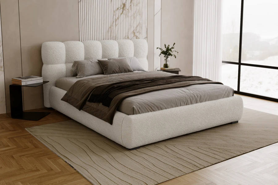 Gemütliches Schlafzimmer mit weißem Polsterbett, modernem Teppich und Nachttisch.