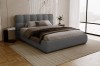 Modernes Schlafzimmer mit anthrazitfarbenem Polsterbett aus strukturiertem Bouclé-Stoff.