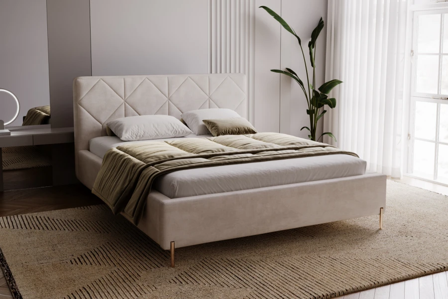 Modern gestoffeerd bed in beige met decoratief ruitstiksel in de slaapkamer.