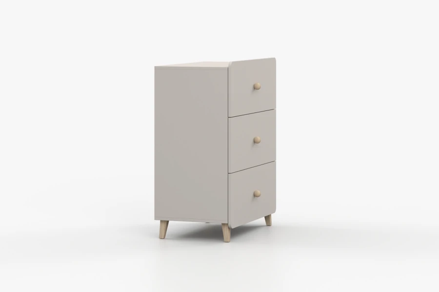 Perspectivisch zicht op de lichtgrijze commode met houten poten voor de kinderkamer.