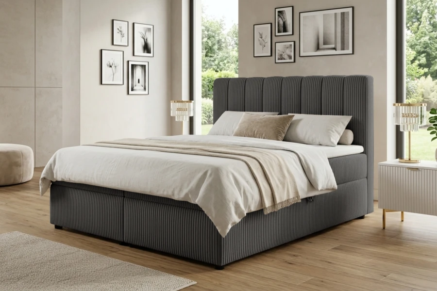 Anthrazitfarbenes Boxspringbett in modern eingerichtetem Schlafzimmer mit hellem Parkettboden.