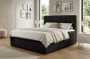 Modernes schwarzes Boxspringbett mit vertikal gestepptem Kopfteil im Schlafzimmer