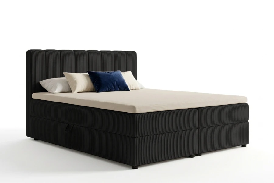 Modernes schwarzes Boxspringbett mit Cord-Bezug und Bettkasten auf weißem Grund.