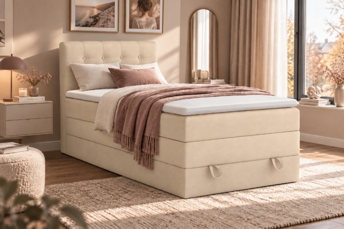 Gemütliches Polsterbett in Creme mit Boxspring-System und Stauraum unter der Matratze.
