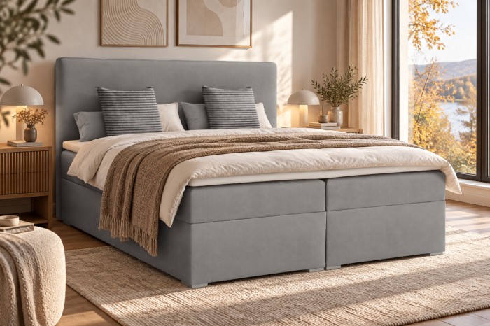 Hellgraues Boxspringbett im skandinavischen Stil mit passender Bettwäsche.