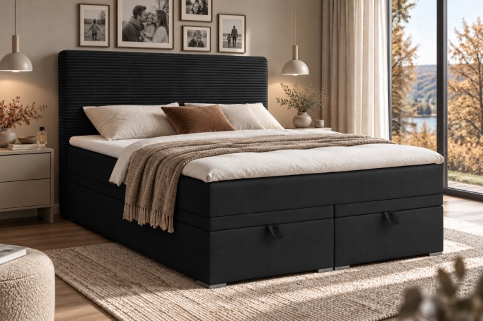 Schwarzes Boxspringbett mit Bettkasten und elegantem geripptem Kopfteil.