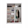 Interior view of a wardrobe with practical compartment layout and clothes rail.