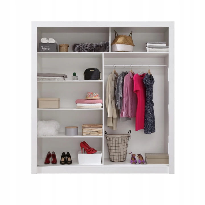 Interior layout of a wardrobe with shelves, clothes rail and baskets.